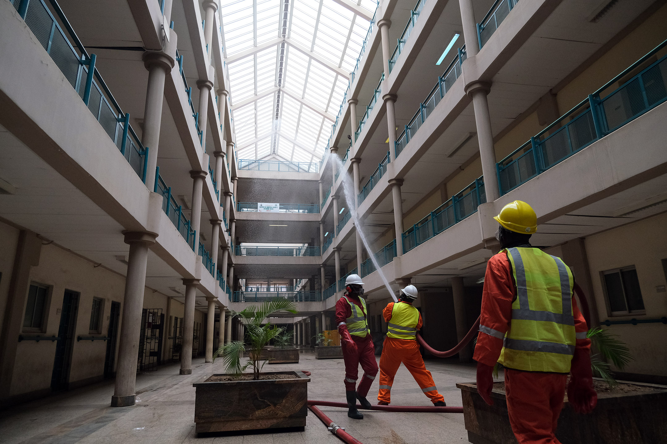 Fire service men are seen fumigating a government building on the second day of a 14-day lockdown aimed at limiting the spread of coronavirus disease (COVID-19), in Abuja, Nigeria April 1, 2020. Photo: Sodiq Adelakun / Channels TV