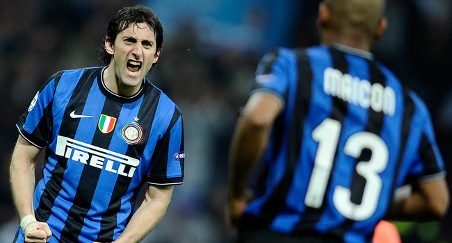 ) In this file photo taken on April 20, 2010 Inter Milan's Brazilian defender Maicon (R) celebrates with teamate Argentinian Diego Milito after scoring against Barcelona during the UEFA Champions League first leg semifinal Inter Milan vs Barcelona football match at San Siro stadium in Milan. Filippo MONTEFORTE / AFP