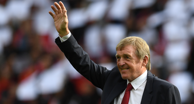 In this file photo Former Liverpool player and manager Kenny Dalglish takes the applause of the supporters a day after having the new grandstand named after him, on the pitch ahead of the English Premier League football match between Liverpool and Manchester United at Anfield in Liverpool, north west England on October 14, 2017. Paul ELLIS / AFP