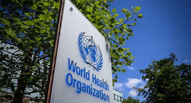 This picture taken on April 24, 2020 shows a sign of the World Health Organization (WHO) in Geneva next to their headquarters, amid the COVID-19 outbreak, caused by the novel coronavirus. Fabrice COFFRINI / AFP