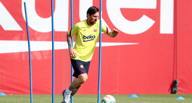 This handout pictured made available by FC Barcelona shows Barcelona's Argentine forward Lionel Messi attending a training session at the Ciutat Esportiva Joan Gamper in Sant Joan Despi on May 8, 2020. Miguel RUIZ / AFP / FC BARCELONA