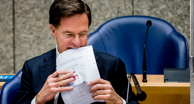 Dutch Prime Minister Mark Rutte holds documents during a parliamentary debate on the coronavirus crisis (COVID-19), in The Hague, on May 20, 2020. Bart MAAT / ANP / AFP