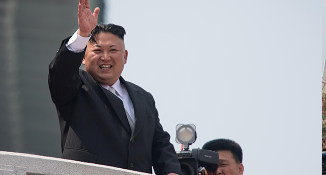 This file photo taken on April 15, 2017 shows North Korean leader Kim Jong Un waving from a balcony of the Grand People's Study House following a military parade marking the 105th anniversary of the birth of late North Korean leader Kim Il-Sung in Pyongyang. ED JONES / AFP
