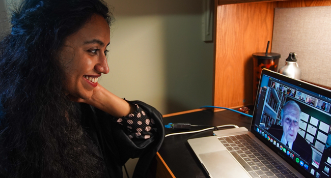 Pakistani student Varsha Thebo, 27, attends her online graduation ceremony in her bedroom at the International Student House where she resides at Georgetown University, in Washington, DC on May 15, 2020. Agnes BUN / AFP