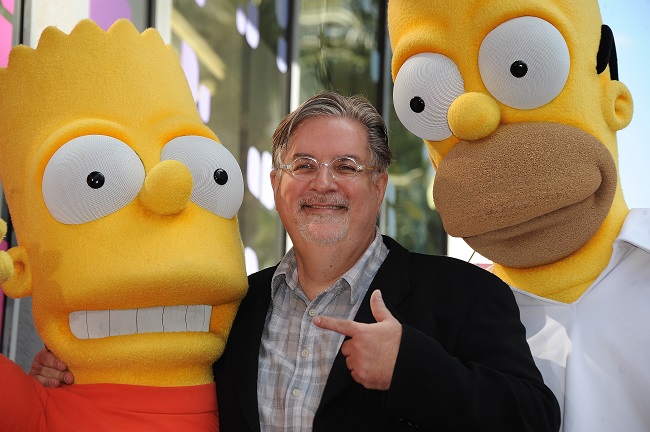 (FILES) In this file photo taken on February 14, 2012 Cartoonist Matt Groening, creator of "The Simpsons," poses with his characters Bart (L) and Homer Simpson as he is honored with the 2,459th star on the Hollywood Walk of Fame in Hollywood. - The producers of The Simpsons, the world-famous animated series, announced June 26 that they will no longer use white actors to dub ethnic minority characters. (Photo by Robyn BECK / AFP)