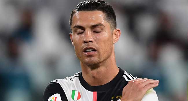 Juventus' Portuguese forward Cristiano Ronaldo reacts during the Italian Cup (Coppa Italia) semi-final second leg football match Juventus vs AC Milan on June 12, 2020 at the Allianz stadium in Turin, the first to be played in Italy since March 9 and the lockdown aimed at curbing the spread of the COVID-19 infection, caused by the novel coronavirus.