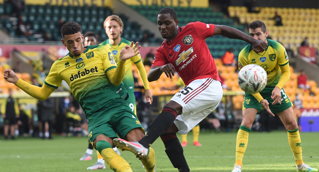 Norwich City's English-born Northern Irish defender Jamal Lewis (L) clocks a shot from Manchester United's Nigerian striker Odion Ighalo during the English FA Cup quarter-final football match between Norwich City and Manchester United at Carrow Road in Norwich, eastern England on June 27, 2020. Joe Giddens / POOL / AFP