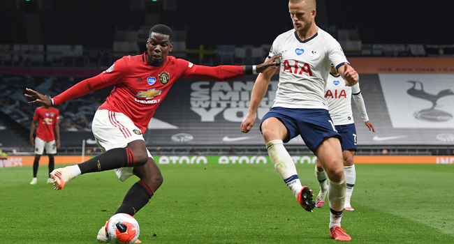 Manchester United's French midfielder Paul Pogba (L) vies for the ball against Tottenham Hotspur's English defender Eric Dier (R) during the English Premier League football match between Tottenham Hotspur and Manchester United at Tottenham Hotspur Stadium in London, on June 19, 2020. Shaun Botterill / POOL / AFP
