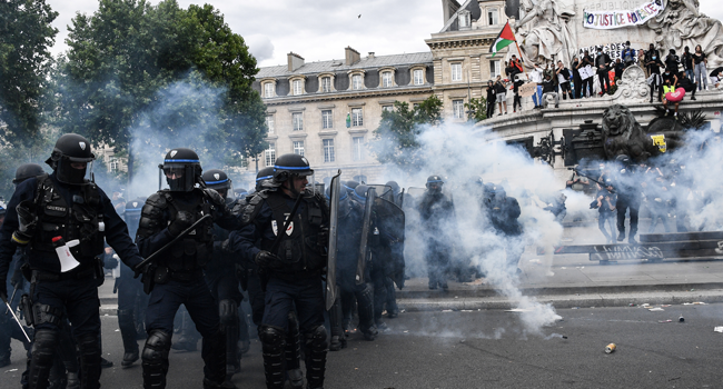 French riot police clash with protesters during a rally as part of the 'Black Lives Matter' worldwide protests against racism and police brutality, on Place de la Republique in Paris on June 13, 2020.  Anne-Christine POUJOULAT / AFP