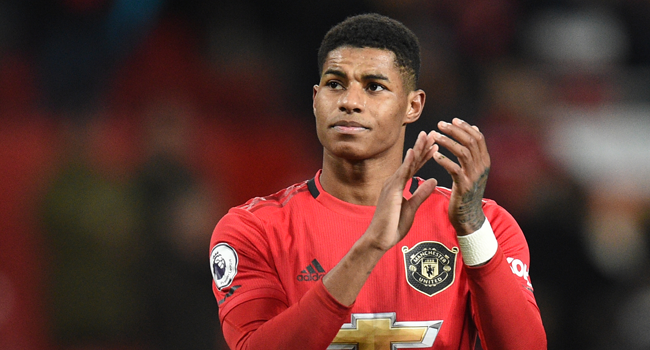 In this file photo taken on December 01, 2019 Manchester United's English striker Marcus Rashford applauds supporters on the pitch after the English Premier League football match between Manchester United and Aston Villa at Old Trafford in Manchester, north west England, on December 1, 2019. Oli SCARFF / AFP