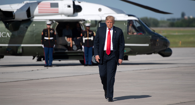 US President Donald Trump walks to board Air Force One prior to departure from Austin Straubel International Airport in Green Bay, Wisconsin, June 25, 2020. SAUL LOEB / AFP