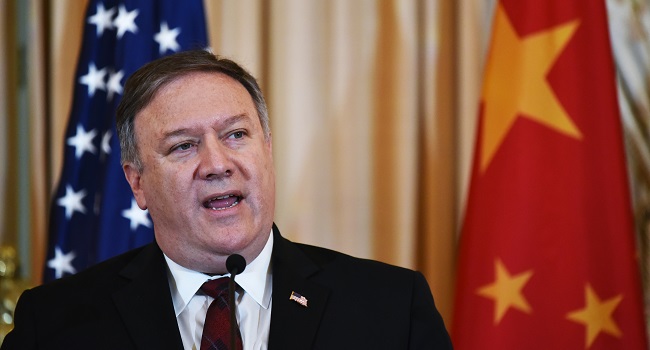 (FILES) In this file photo taken on November 9, 2018 US Secretary of State Mike Pompeo speaks during a press conference with Chinese politburo member Yang Jiechi and Defense Minister Wei Fenghe during the US-China Diplomatic and Security Dialogue in the Benjamin Franklin Room of the State Department in Washington, DC. - The United States said July 9, 2020 it would refuse visas for three top Chinese officials and their families over the "horrific and systematic abuses" against Uighurs and other Turkic Muslims. Secretary of State Mike Pompeo said the officials who would be refused entry include Chen Quanguo, the Communist Party secretary for the Xinjiang region who is considered an architect of Beijing's hardline policies on minorities. (Photo by MANDEL NGAN / AFP)