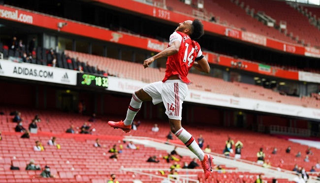 Arsenal's Gabonese striker Pierre-Emerick Aubameyang celebrates after scoring a goal during the English Premier League football match between Arsenal and Norwich City at the Emirates Stadium in London on July 1, 2020. (Photo by Shaun Botterill / POOL / AFP) / RESTRICTED TO EDITORIAL USE. No use with unauthorized audio, video, data, fixture lists, club/league logos or 'live' services. Online in-match use limited to 120 images. An additional 40 images may be used in extra time. No video emulation. Social media in-match use limited to 120 images. An additional 40 images may be used in extra time. No use in betting publications, games or single club/league/player publications. /