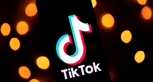 In this file photo illustration taken on November 21, 2019, the logo of the social media video-sharing app Tiktok is displayed on a tablet screen in Paris. (Photo by Lionel BONAVENTURE / AFP) 