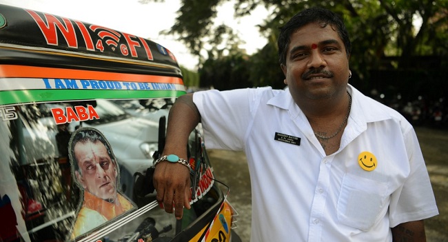 In this file photo taken on September 22, 2017 Sandeep Bacche, an Indian rickshaw driver and fan of Bollywood actor Sanjay Dutt, poses for a picture in Mumbai. PUNIT PARANJPE / AFP