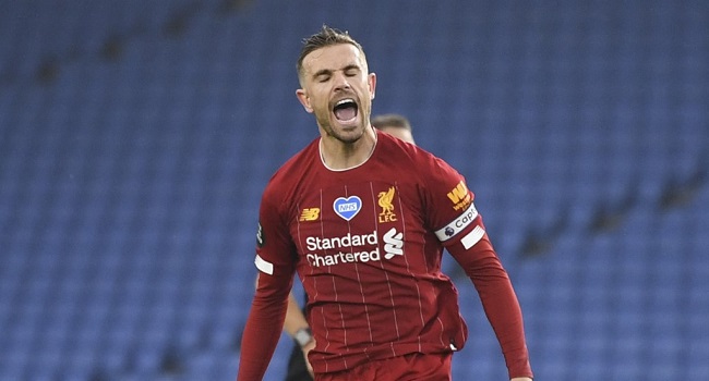 Liverpool's English midfielder Jordan Henderson celebrates scoring their second goal during the English Premier League football match between Brighton and Hove Albion and Liverpool at the American Express Community Stadium in Brighton, southern England on July 8, 2020. (Photo by DANIEL LEAL-OLIVAS / POOL / AFP)