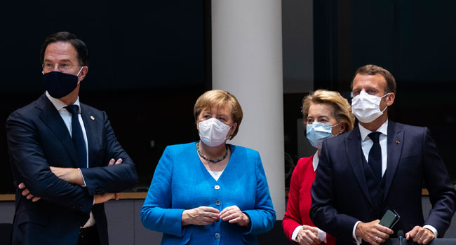 Netherlands' Prime Minister Mark Rutte (L) looks on next to Germany's Chancellor Angela Merkel ( 2nd L), President of the European Commission Ursula von der Leyen (2nd R) and France's President Emmanuel Macron prior the start of the European Council building in Brussels, on July 18, 2020, as the leaders of the European Union hold their first face-to-face summit over a post-virus economic rescue plan. Francisco Seco / POOL / AFP