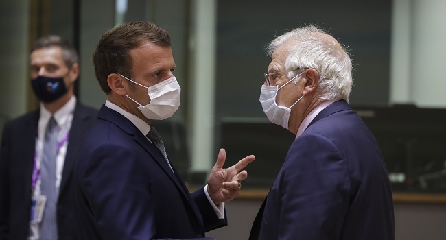 French President Emmanuel Macron (L) talks with High Representative of the European Union Josep Borrel prior the start of the European Union Council in Brussels on July 17, 2020, as the leaders of the European Union hold their first face-to-face summit over a post-virus economic rescue plan. - The EU has been plunged into a historic economic crunch by the coronavirus crisis, and EU officials have drawn up plans for a huge stimulus package to lead their countries out of lockdown.