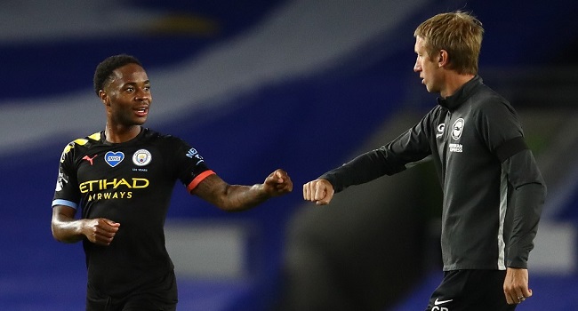 Manchester City's English midfielder Raheem Sterling (L) fist pumps Brighton's English manager Graham Potter after the English Premier League football match between Brighton and Hove Albion and Manchester City at the American Express Community Stadium in Brighton, southern England on July 11, 2020. (Photo by Julian Finney / POOL / AFP) 