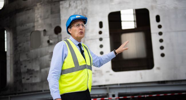 Director-General of the ITER organisation Bernard Bigot speaks in front of the lower cyclinder of the cryostat, which provides the high vacuum, ultra-cool environment for the vacuum vessel and the superconducting magnets during the launch of the assembly stage of nuclear fusion machine "Tokamak" of the International Thermonuclear Experimental Reactor (ITER) in Saint-Paul-les-Durance, southeastern France, on July 28, 2020. Director-General of the ITER organisation Bernard Bigot speaks in front of the CLEMENT MAHOUDEAU / AFP