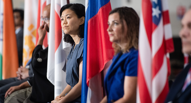 Scientific attache of the South Korean Embassy Lee Eun-ju sits with other representatives of the ITER member states during the launch of the assembly stage of nuclear fusion machine "Tokamak" of the International Thermonuclear Experimental Reactor (ITER) in Saint-Paul-les-Durance, southeastern France, on July 28, 2020. CLEMENT MAHOUDEAU / AFP