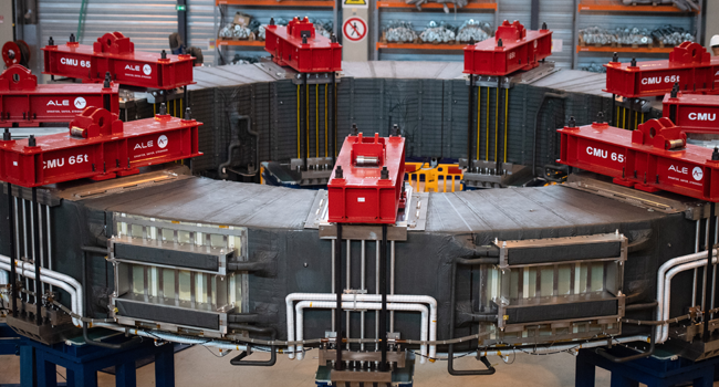 A picture shows the fully-assembled 10-metre-large poloidal field coil number 6 (PF6), assembled by China, in the winding facility for the construction of poloidal field coils which will be part of the magnetic system that will contribute to confine and model plasma during the launch of the assembly stage of nuclear fusion machine "Tokamak" of the International Thermonuclear Experimental Reactor (ITER) in Saint-Paul-les-Durance, southeastern France, on July 28, 2020. CLEMENT MAHOUDEAU / AFP