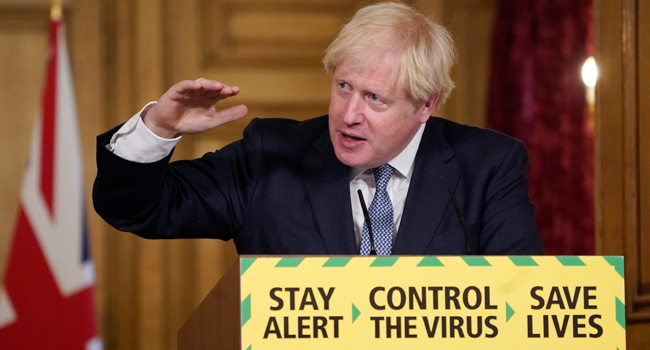 A handout image released by 10 Downing Street, shows Britain's Prime Minister Boris Johnson attending a remote press conference to update the nation on the novel coronavirus COVID-19 pandemic inside 10 Downing Street in central London on July 31, 2020. Andrew PARSONS / POOL / 10 Downing Street / AFP