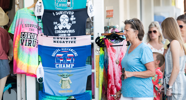 A woman walks into a store on July 17, 2020 in St. Simons Island, Georgia. Sean Rayford / GETTY IMAGES NORTH AMERICA / Getty Images via AFP