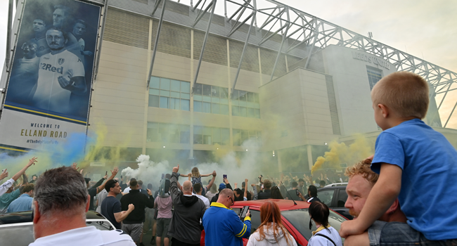 Leeds United supporters gather outside their Elland Road ground to celebrate the club's return to the Premier League after a gap of 16 years, in Leeds, northern England on July 17, 2020.  Paul ELLIS / AFP