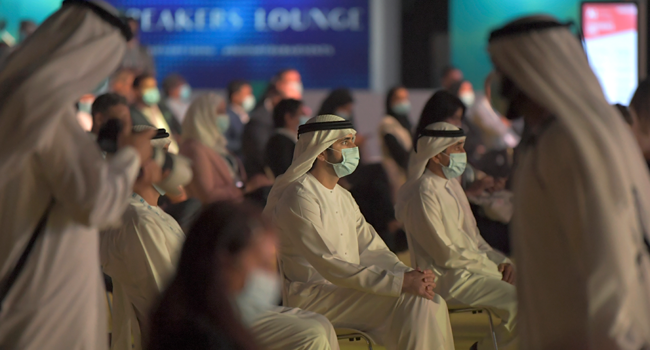 Dubai's Crown Prince Sheikh Hamdan bin Mohammed Al-Maktoum (C) attends the first "real life" conference in the Gulf city on July 16, 2020, since the coronavirus protective restrictions were put in place in March. KARIM SAHIB / AFP