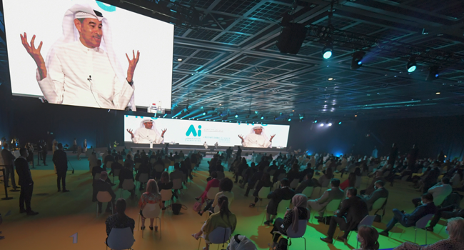 The image of Emirati businessman Mohamed Alabba is projected on large screens as he speaks at the first "real life" conference in the Gulf city of Dubai, on July 16, 2020, since the coronavirus protective restrictions were put in place in March. KARIM SAHIB / AFP