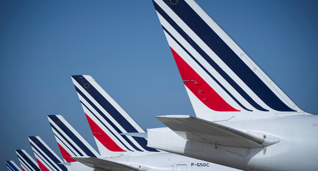 In this file photo taken on August 07, 2018 (FILES) In this file picture taken on August 7, 2018 shows a Air France planes parked on the tarmac of Roissy-Charles de Gaulle Airport, north of Paris. JOEL SAGET / AFP