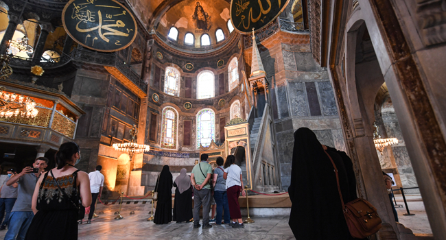 Tourists visit the inside of Hagia Sophia on July 10, 2020, in Istanbul, before a top Turkish court revoked the sixth-century Hagia Sophia's status as a museum, clearing the way for it to be turned back into a mosque. Ozan KOSE / AFP