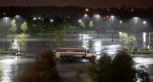 A single truck is parked in an open lot as heavy rains from hurricane Laura fall in Lake Charles, Louisiana on August 26, 2020. ANDREW CABALLERO-REYNOLDS / AFP