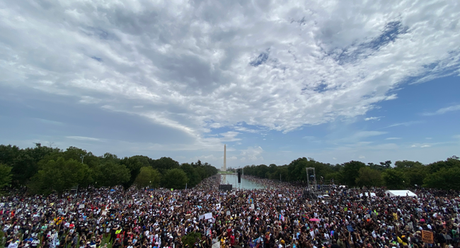 People attend the "Commitment March: Get Your Knee Off Our Necks" protest against racism and police brutality, on August 28, 2020, at the Lincoln Memorial in Washington, DC. Eric BARADAT / AFP