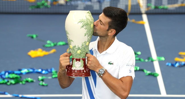  Novak Djokovic of Serbia kisses the trophy after defeating Milos Raonic of Canada in their Men's Singles Final match of the 2020 Western & Southern Open at USTA Billie Jean King National Tennis Center on August 29, 2020 in the Queens borough of New York City. Matthew Stockman/Getty Images/AFP