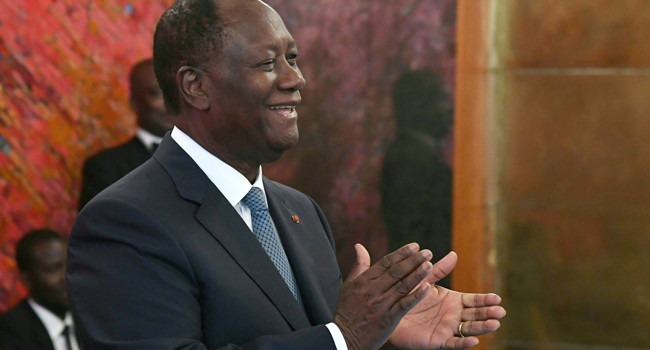 A picture taken on August 5, 2019 shows Ivory Coast President Alassane Ouattara applauding during a ceremony at the presidential palace in Abidjan. ISSOUF SANOGO / AFP