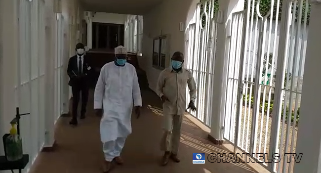 APC Veteran Adams Oshiomhole (R) and Chief of Staff to President Muhammadu Buhari, Ibrahim Gambari, at a State House corridor on August 17, 2020.