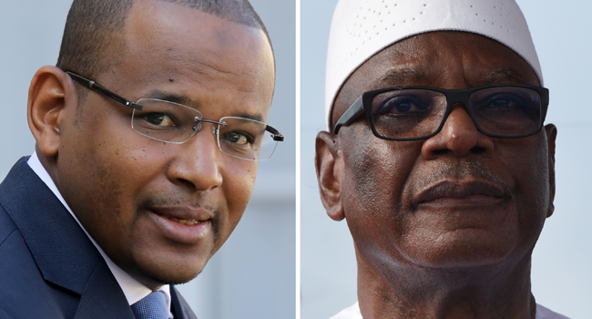 A combination of file pictures created on August 18, 2020 in Paris shows Malian Prime Minister Boubou Cisse (L) leaving the Elysee Palace after a meeting with the French president on September 10, 2019 in Paris, and Malian President Ibrahim Boubacar Keita (R) pictured during his arrival at Felix Houphouet Boigny Airport in Abidjan for a visit on May 10, 2018. Sia KAMBOU, Ludovic MARIN / AFP