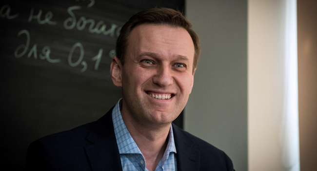 In this file photo taken on January 16, 2018 Russian opposition leader Alexei Navalny smiles during an interview with AFP at the office of his Anti-corruption Foundation (FBK) in Moscow. Mladen ANTONOV / AFP