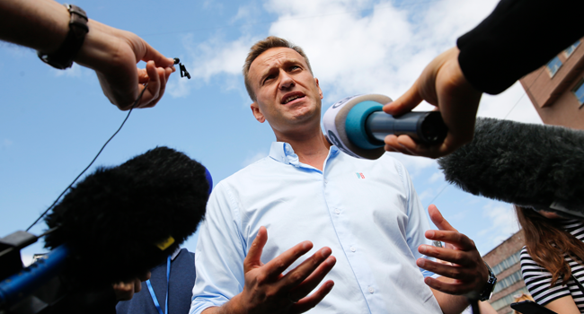  In this file photo taken on July 20, 2019 Russian opposition leader Alexei Navalny speaks with journalists during a rally to support opposition and independent candidates after authorities refused to register them for September elections to the Moscow City Duma, Moscow. Maxim ZMEYEV / AFP