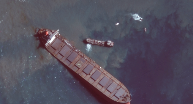 This August 12, 2020, handout satellite image obtained courtesy of Maxar Technologies shows the MV Wahashio shipwreck off the southeast coast of Mauritius. Handout / Satellite image ©2020 Maxar Technologies / AFP