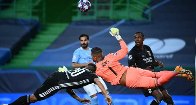 Lyon's Portuguese goalkeeper Anthony Lopes vies for the ball beside Lyon's Brazilian defender Marcal (L) during the UEFA Champions League quarter-final football match between Manchester City and Lyon at the Jose Alvalade stadium in Lisbon on August 15, 2020. FRANCK FIFE / POOL / AFP