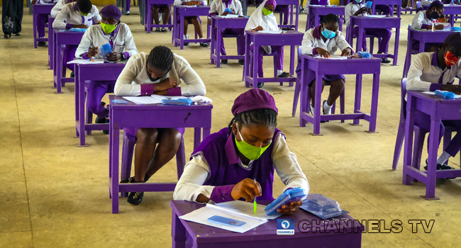 Wearing face-masks, final year students of Government Secondary School, Zone 3, Abuja, sit in a classroom as they write their West African Examinations Council exams, following the ease of COVID-19 lockdown order on Monday August 17, 2020. Photo: Sodiq Adelakun/Channels Television.