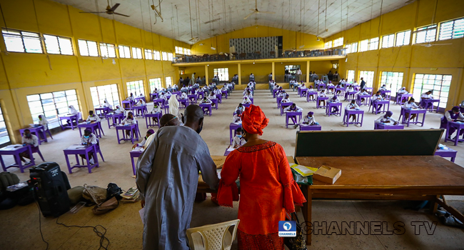 Wearing face-masks, final year students of Government Secondary School, Zone 3, Abuja, sit in a classroom as they write their West African Examinations Council exams, following the ease of COVID-19 lockdown order on Monday August 17, 2020. Photo: Sodiq Adelakun/Channels Television.