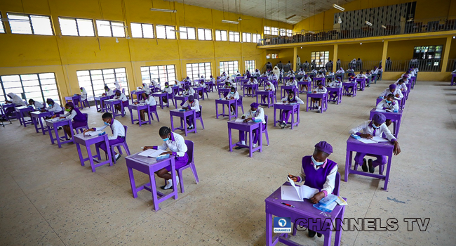 Wearing face-masks, final year students of Government Secondary School, Zone 3, Abuja, sit in a classroom as they write their West African Examinations Council exams, following the ease of COVID-19 lockdown order on Monday August 17, 2020. Photo: Sodiq Adelakun/Channels Television.