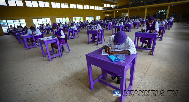 Wearing face-masks, final year students of Government Secondary School, Zone 3, Abuja, sit in a classroom as they write their West African Examinations Council exams, following the ease of COVID-19 lockdown order on Monday August 17, 2020. Photo: Sodiq Adelakun/Channels Television.