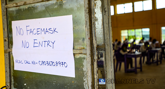 Wearing face-masks, final year students of Government Secondary School, Zone 3, Abuja, sit in a classroom as they write their West African Examinations Council exams, following the ease of COVID-19 lockdown order on Monday August 17, 2020. Photo: Sodiq Adelakun/Channels Television.