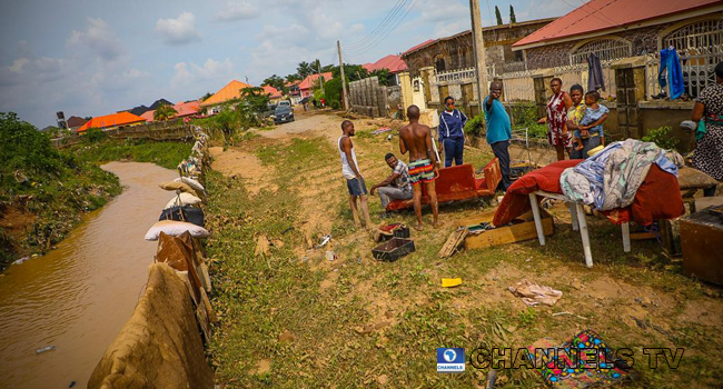 Trademoore Estate, Lugbe, Abuja was flooded after a torrential rainfall on August 26, 2020. Photos: Sodiq Adelakun/ Channels Television