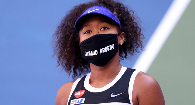 : Naomi Osaka of Japan wears a protective face mask with the name, Ahmaud Arbery stenciled on it after winning her Women's Singles third round match against Marta Kostyuk of the Ukraine on Day Five of the 2020 US Open at USTA Billie Jean King National Tennis Center on September 04, 2020 in the Queens borough of New York City. Al Bello/Getty Images/AFP